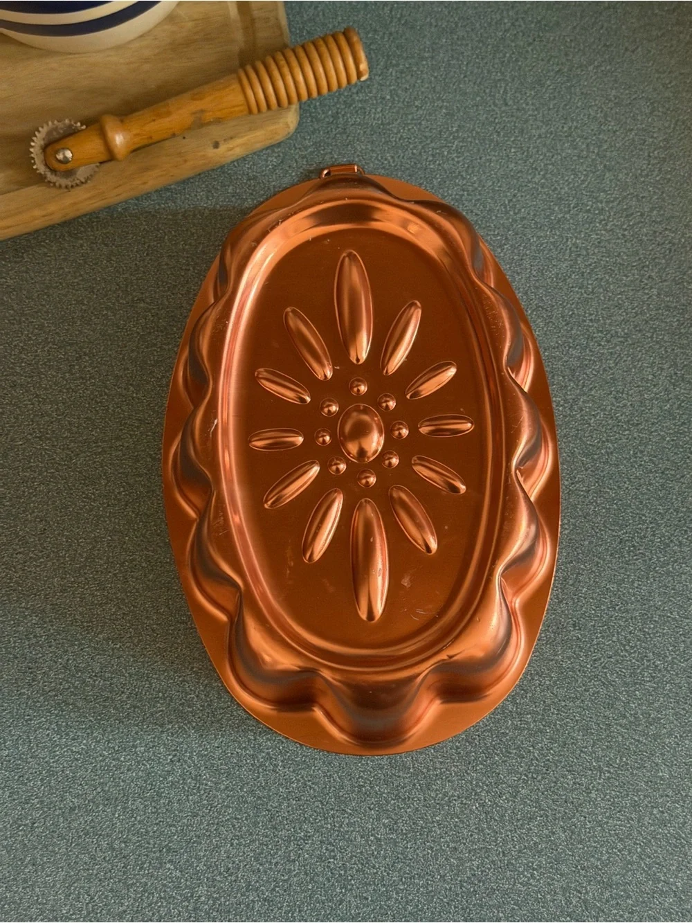 Vintage copper-colored aluminum daisy pattern mold